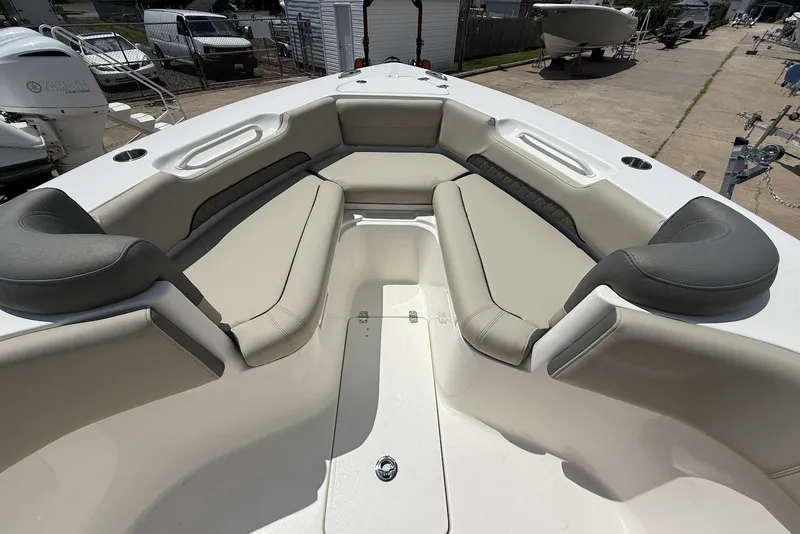 Slide: The Image of 2027 Key West 249 FS boat interior with cushioned seating and cup holders. - 20