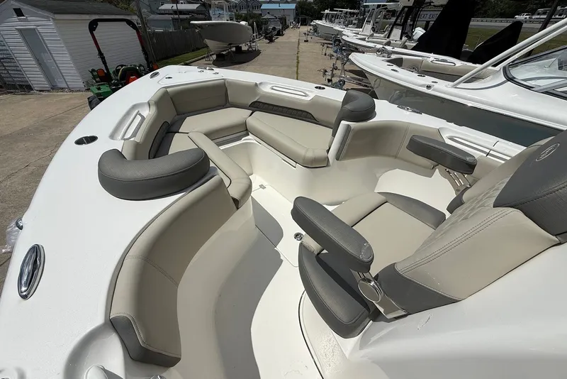 Slide: The Image of 2027 Key West 249 FS boat interior with cushioned seating and armrests. - 18