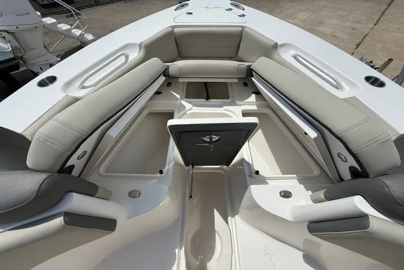 Slide: The Image of 2027 Key West 249 FS boat interior with spacious seating and storage compartments. - 21