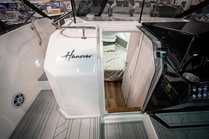 Slide: The Image of Interior view of 2026 Hanover 347 boat, featuring cabin entrance and sleek design. - 7