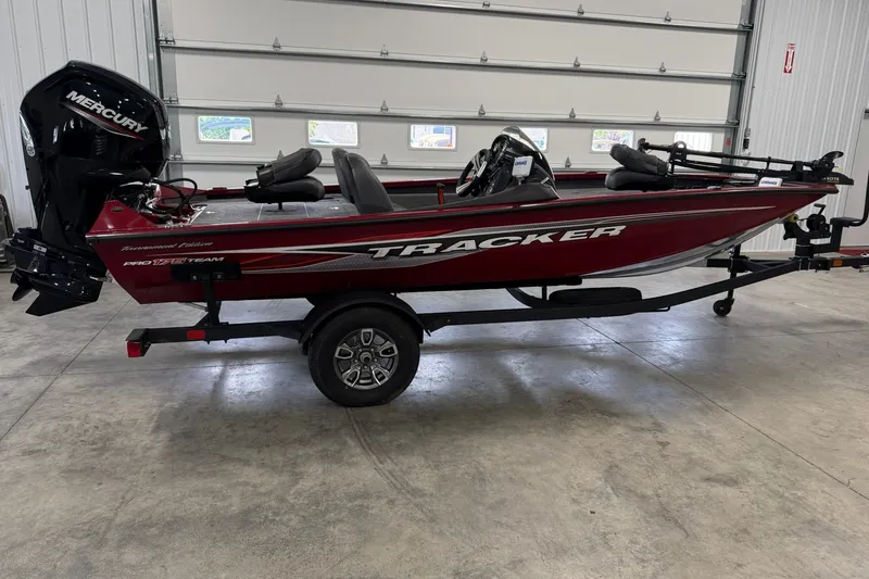 The Image of 2024 Tracker Pro Team 175 TXW Tournament Edition boat in a garage setting. - 1
