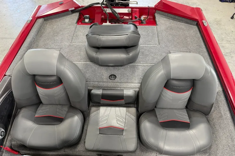 Slide: The Image of 2024 Tracker Pro Team 175 TXW Tournament Edition boat interior with gray and red seating. - 20