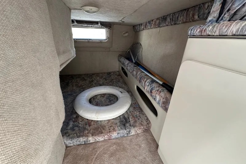 Slide: The Image of Interior cabin of 2000 Wellcraft 2600 Martinique boat with life preserver. - 15