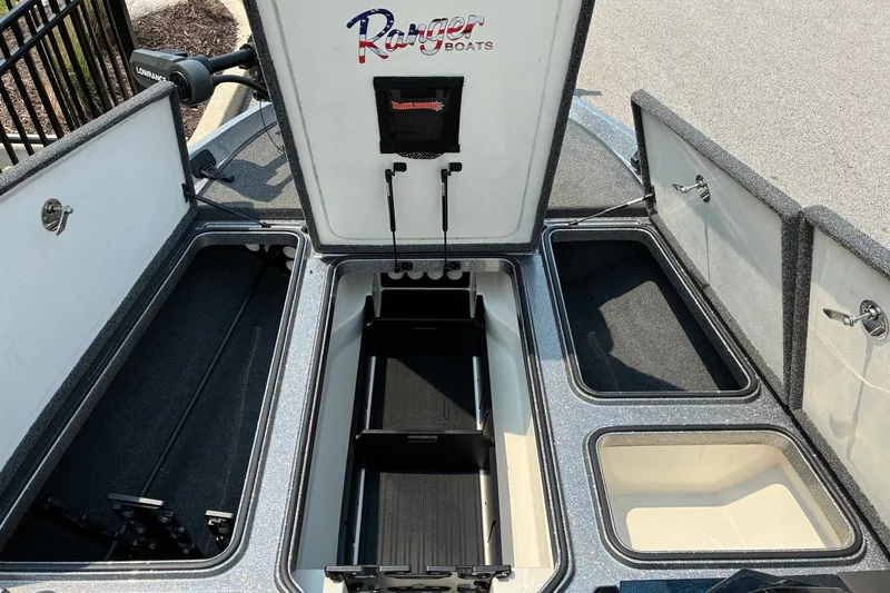 Slide: The Image of 2020 Ranger Z185 boat storage compartments open, showcasing organized interior layout. - 19