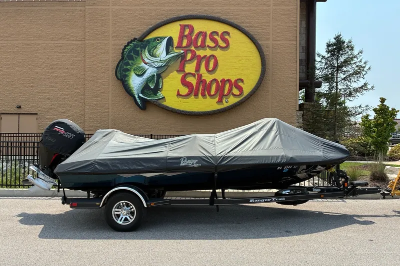 Slide: The Image of 2020 Ranger Z185 boat covered, parked outside Bass Pro Shops. - 28