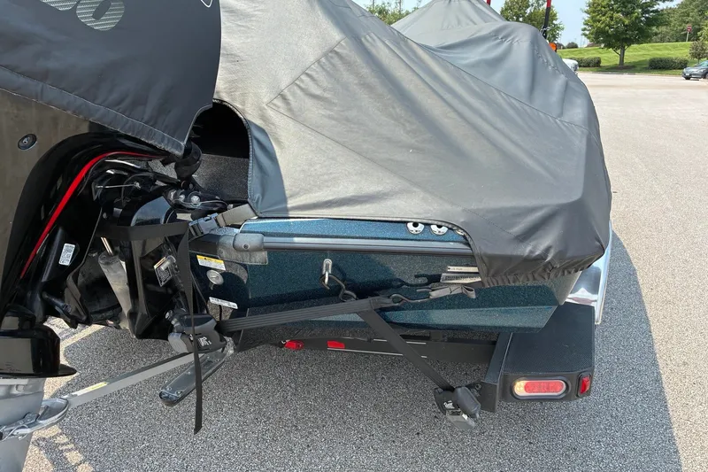 Slide: The Image of 2020 Ranger Z185 boat with cover, parked on asphalt. - 31