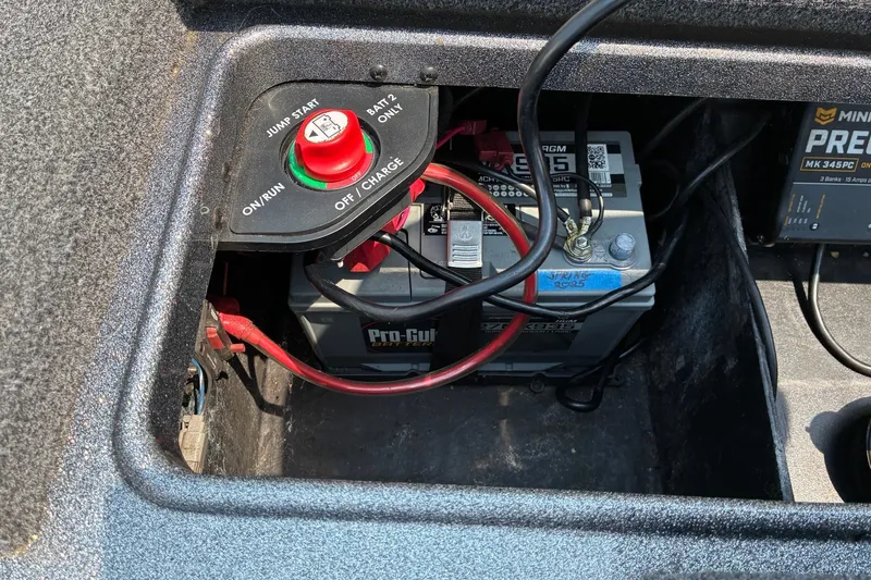 Slide: The Image of Battery compartment of a 2020 Ranger Z185 boat with Pro-Guide battery and wiring. - 27