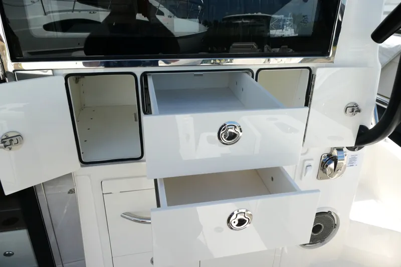 Slide: The Image of 2026 Boston Whaler 405 Conquest interior storage drawers and compartments. - 11