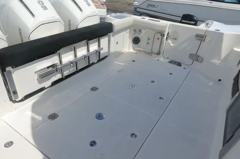 Slide: The Image of Boston Whaler 405 Conquest 2026 boat deck with seating and Mercury engines. - 6