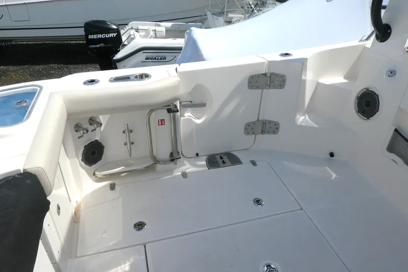 Slide: The Image of 2026 Boston Whaler 405 Conquest boat interior with seating and storage features. - 8