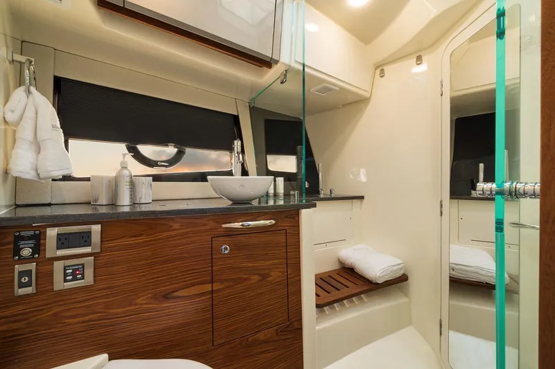 Slide: The Image of Manufacturer Provided Image: Luxurious bathroom interior of 2026 Boston Whaler 405 Conquest yacht, featuring modern amenities and elegant design. - 3