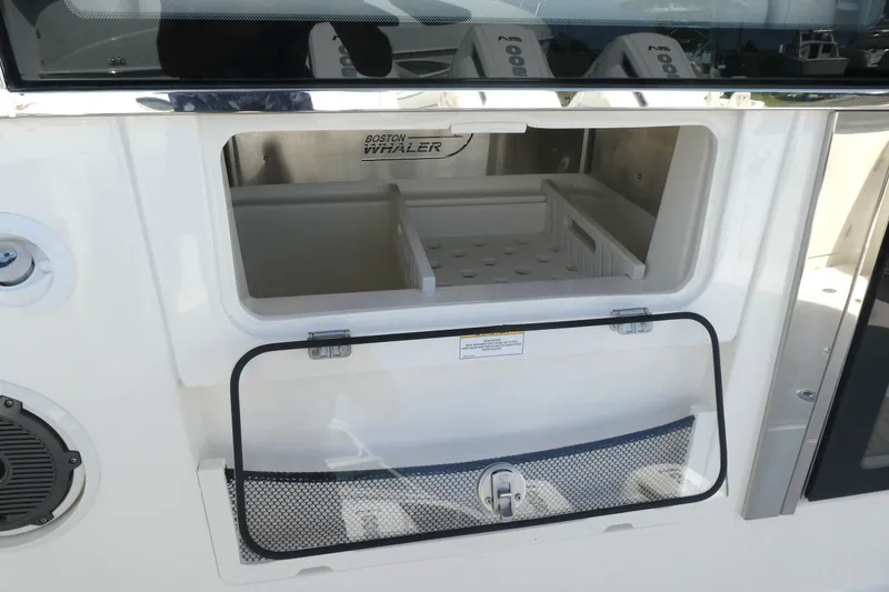 Slide: The Image of Open storage compartment on a 2026 Boston Whaler 405 Conquest boat. - 7