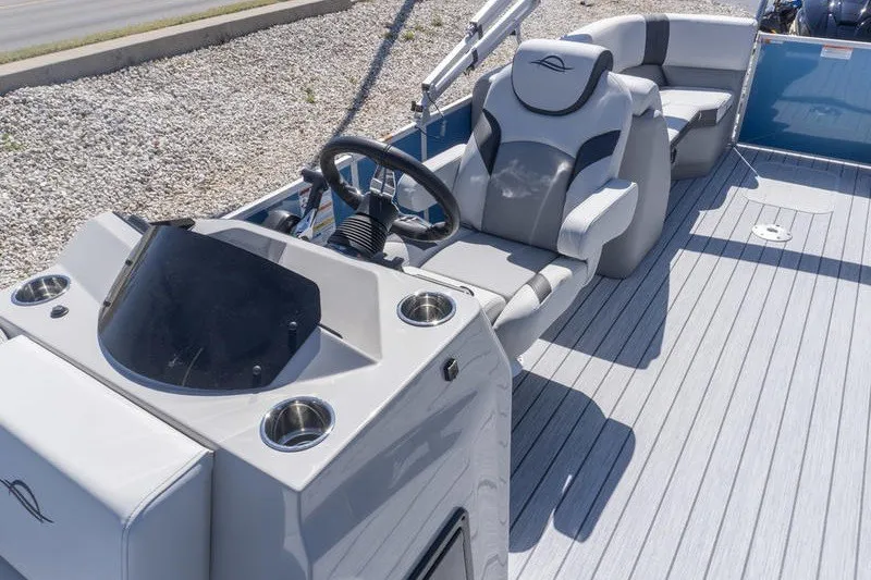 Slide: The Image of 2026 SunCatcher Select 322RC boat interior with steering console and seating. - 20