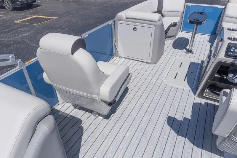 Slide: The Image of Luxurious interior of 2026 SunCatcher Select 322RC pontoon boat with plush seating. - 7