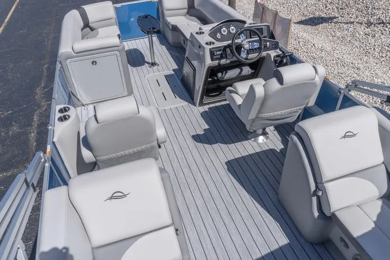 Slide: The Image of 2026 SunCatcher Select 322RC pontoon boat interior with plush seating and modern dashboard. - 6