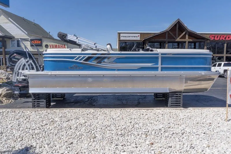 The Image of 2026 SunCatcher Select 322RC pontoon boat displayed outdoors at a dealership. - 1