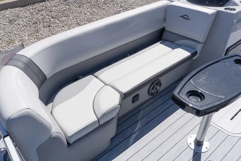 Slide: The Image of 2026 SunCatcher Select 322RC boat interior with sleek seating and table. - 18