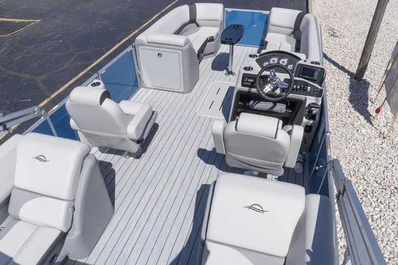 Slide: The Image of 2026 SunCatcher Select 322RC pontoon boat interior with modern seating and steering console. - 4