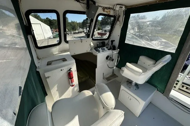 Slide: The Image of Interior of a 2002 Eastern 22 Lobster Fisherman boat with seating and controls. - 10
