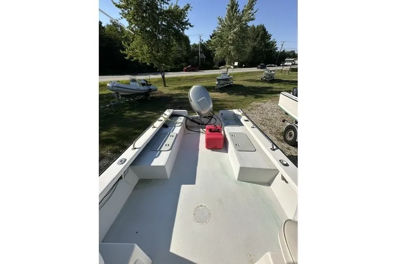 Slide: The Image of 2002 Eastern 22 Lobster Fisherman boat deck with seating and storage, outdoors. - 13