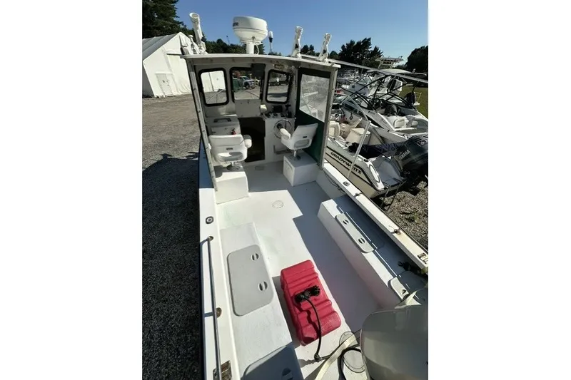 Slide: The Image of 2002 Eastern 22 Lobster Fisherman boat with open deck, seating, and equipment storage. - 5