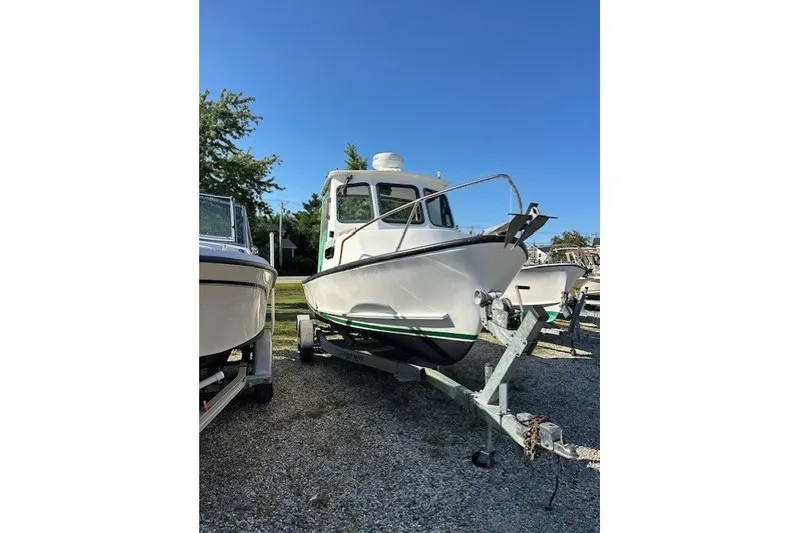 The Image of 2002 Eastern 22 Lobster Fisherman boat on trailer, parked outdoors under clear blue sky. - 1