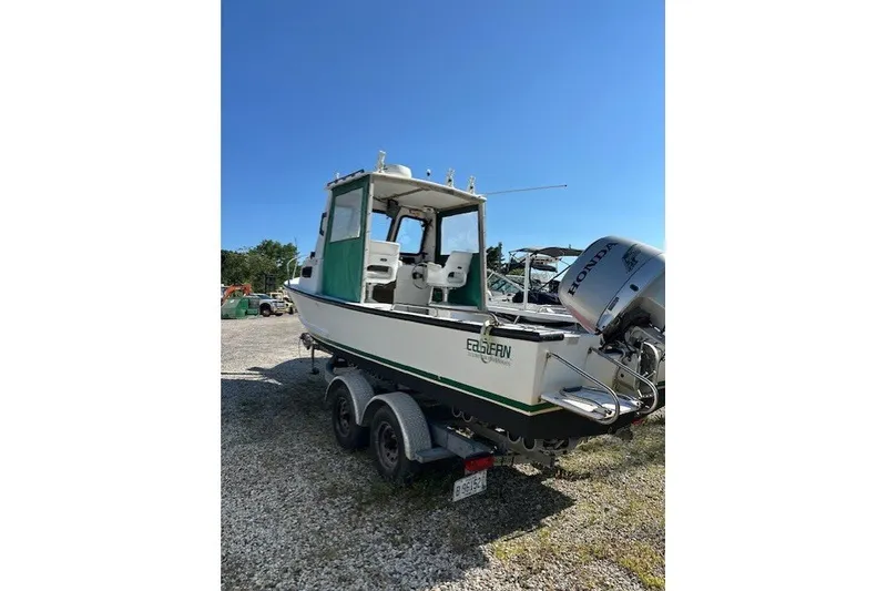 Slide: The Image of 2002 Eastern 22 Lobster Fisherman boat on trailer, featuring Honda outboard motor. - 3