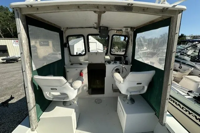 Slide: The Image of 2002 Eastern 22 Lobster Fisherman boat interior with dual seats and control panel. - 6