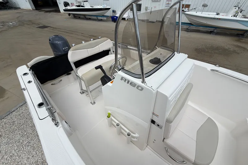 Slide: The Image of 2017 Robalo R180 Center Console boat with seating and console view. - 14