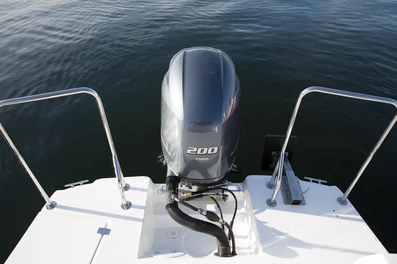 Slide: The Image of 2027 Ranger Tugs R-23 boat with Yamaha 200 outboard motor on calm water. - 9