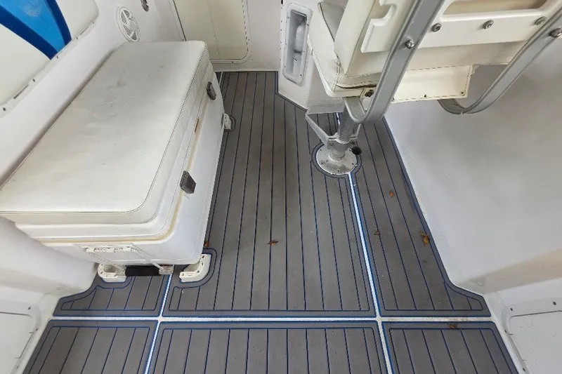 Slide: The Image of Interior of 2006 Twin Vee 26 Express boat with seating and storage. - 31