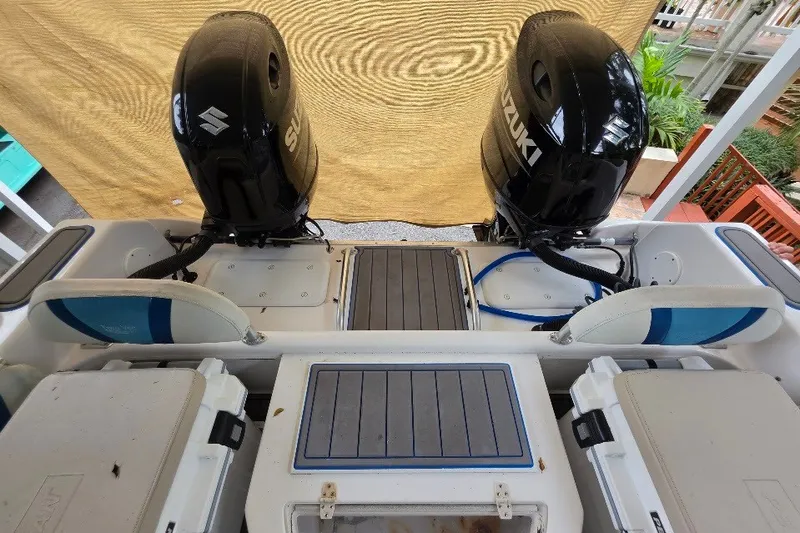 Slide: The Image of 2006 Twin Vee 26 Express boat with dual Suzuki outboard motors, rear deck view. - 29