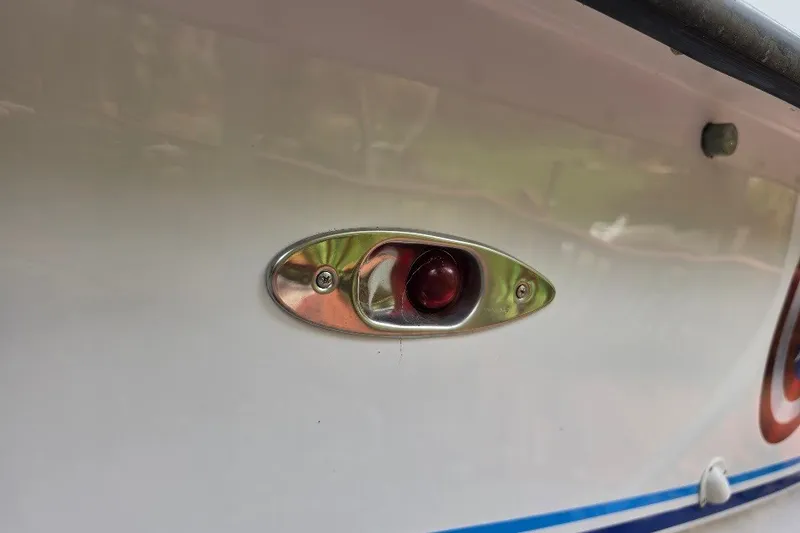 Slide: The Image of Close-up of a 2006 Twin Vee 26 Express boat's red navigation light. - 15