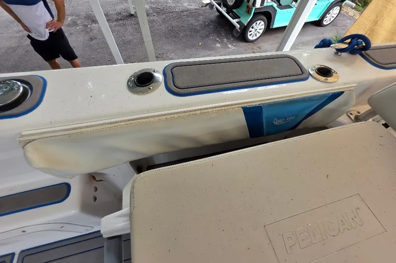 Slide: The Image of 2006 Twin Vee 26 Express boat interior with Pelican cooler and rod holders. - 47