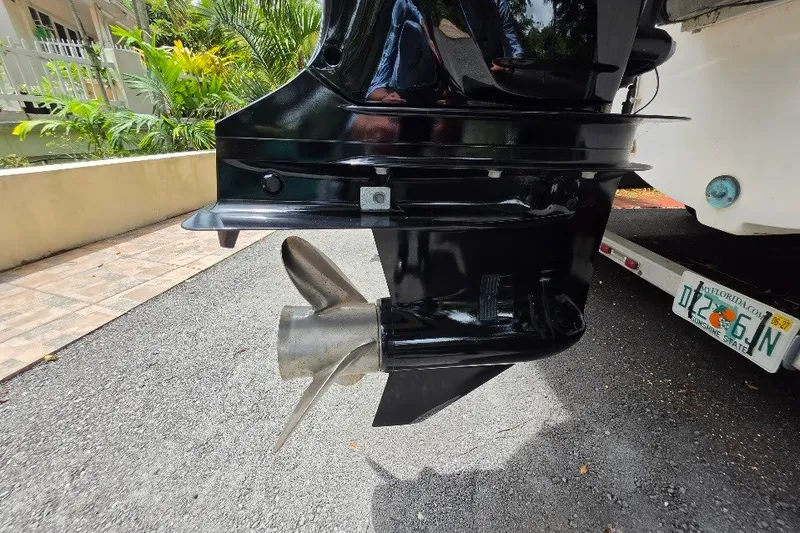 Slide: The Image of Close-up of a 2006 Twin Vee 26 Express boat's outboard motor and propeller. - 22