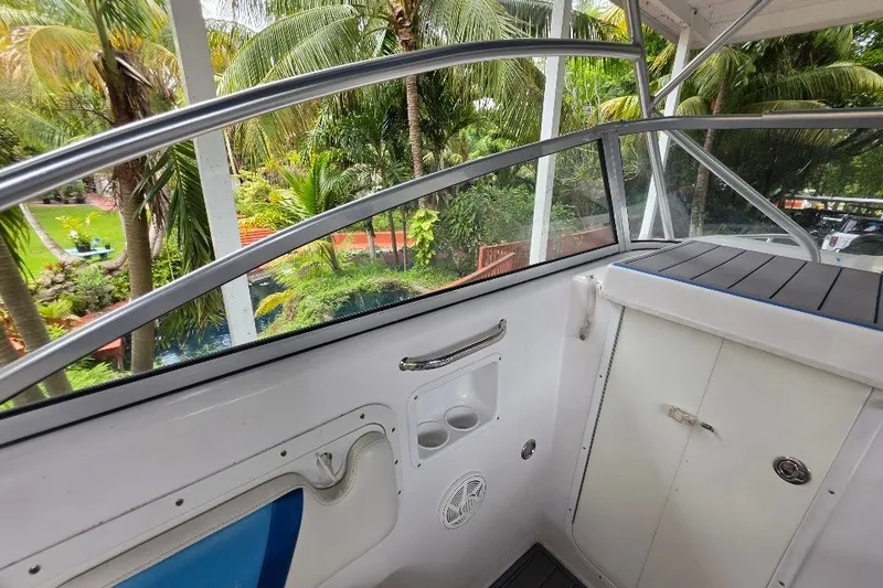 Slide: The Image of 2006 Twin Vee 26 Express boat interior with tropical garden view. - 45