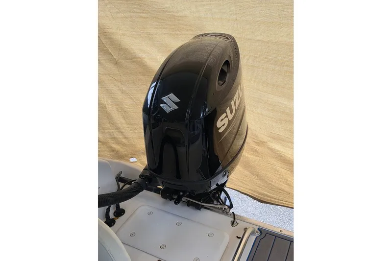 Slide: The Image of Suzuki outboard motor on a 2006 Twin Vee 26 Express boat. - 20
