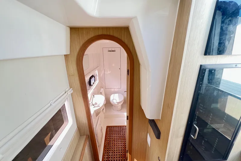 Slide: The Image of Interior of 2019 Aquila 36 Sport yacht, featuring a compact bathroom with modern amenities. - 30
