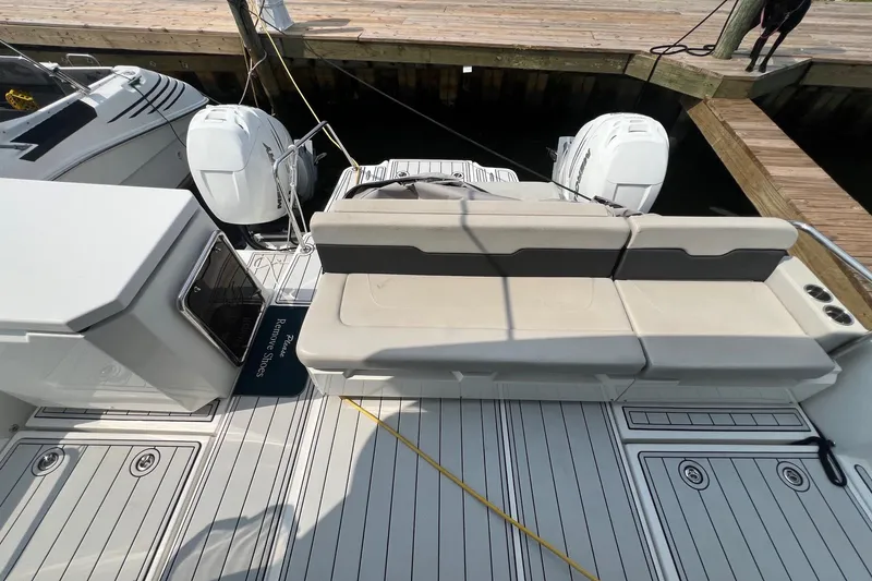 Slide: The Image of Aquila 36 Sport 2019 boat with dual engines and spacious seating at the dock. - 24