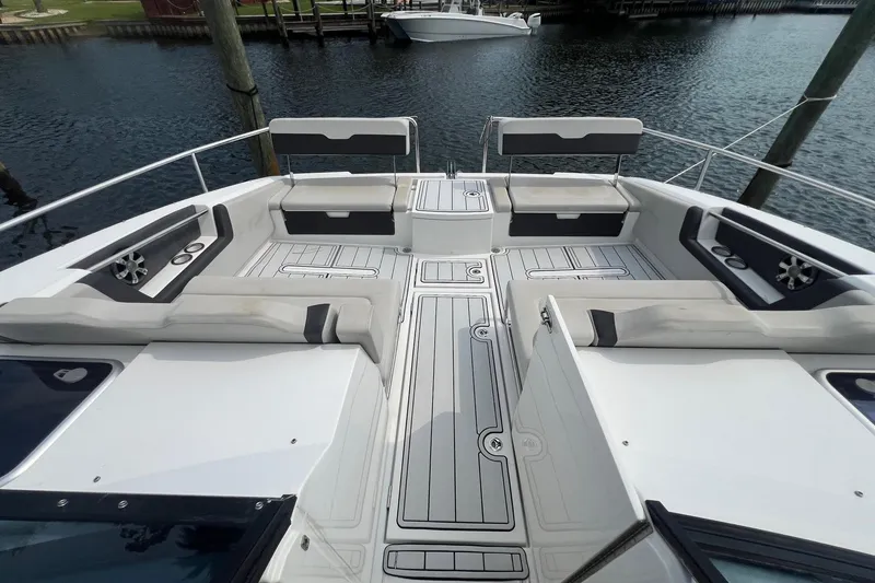 Slide: The Image of Aquila 36 Sport 2019 boat interior with spacious seating and sleek design on the water. - 20