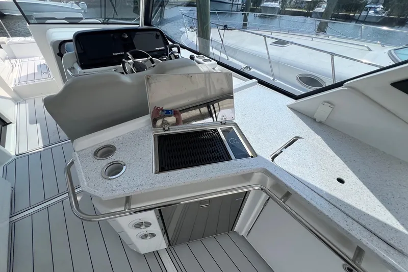 Slide: The Image of Modern 2019 Aquila 36 Sport yacht interior with sleek kitchen and navigation area. - 13