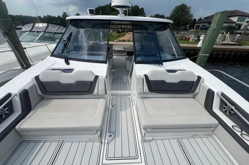 Slide: The Image of 2019 Aquila 36 Sport boat interior with cushioned seating and sleek design. - 18
