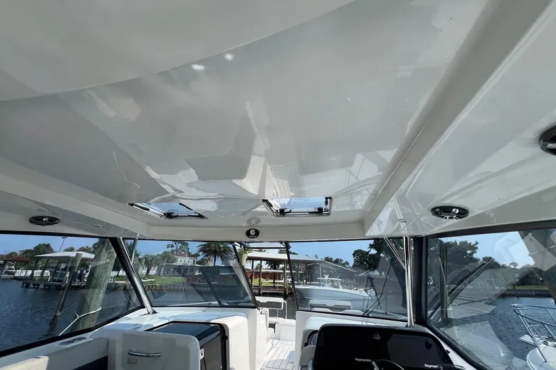 Slide: The Image of Interior view of 2019 Aquila 36 Sport boat with sleek design and panoramic windows. - 15