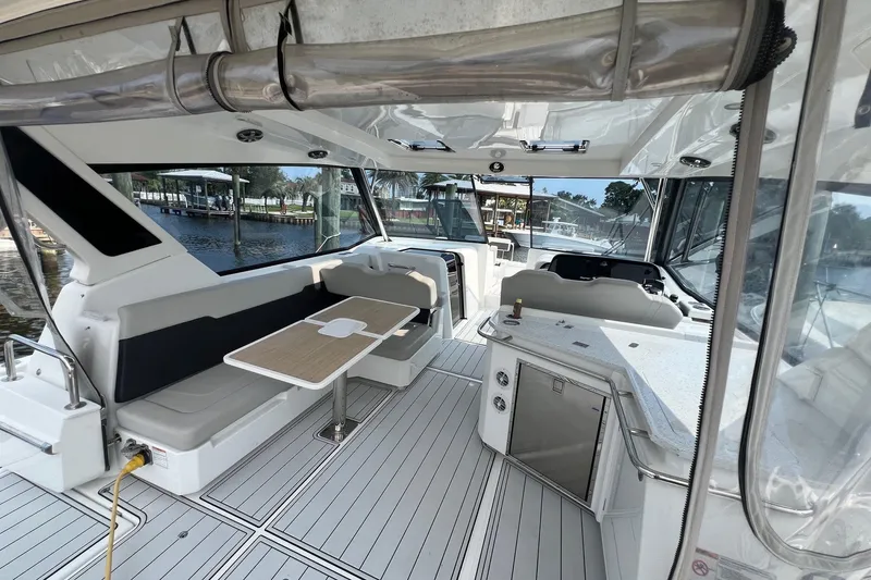 Slide: The Image of Interior of 2019 Aquila 36 Sport yacht with seating and dining area. - 23