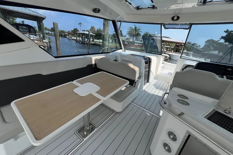 Slide: The Image of Interior of 2019 Aquila 36 Sport yacht with seating and table, dockside view. - 25