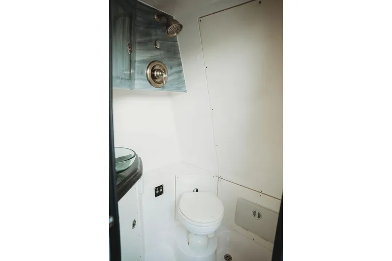 Slide: The Image of Compact bathroom in 2018 MTI 57 boat with modern fixtures and sleek design. - 54