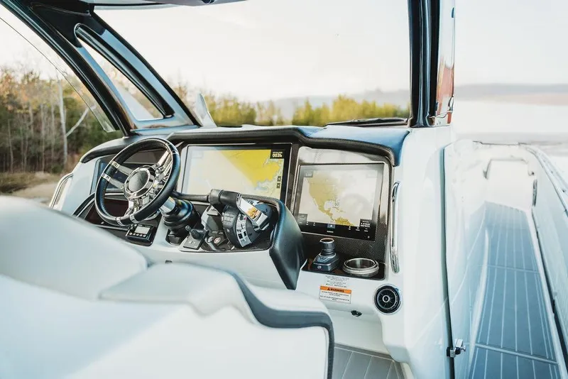 Slide: The Image of Cockpit of 2018 MTI 57 boat with advanced navigation system and steering wheel. - 32