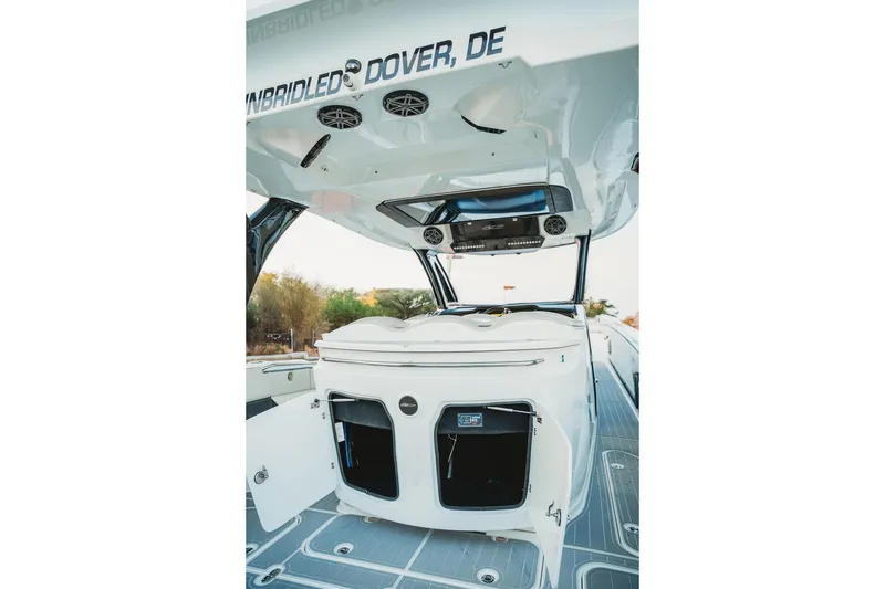 Slide: The Image of 2018 MTI 57 boat interior with open storage compartments and sleek design. - 37