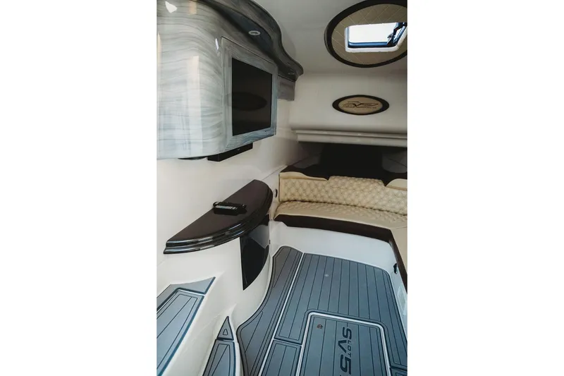 Slide: The Image of Luxurious interior of 2018 MTI 57 boat with TV and plush seating. - 57