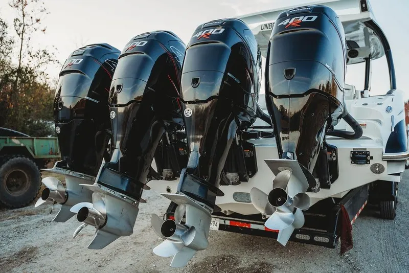 Slide: The Image of Four powerful Mercury 400R outboard engines on a 2018 MTI 57 boat. - 25